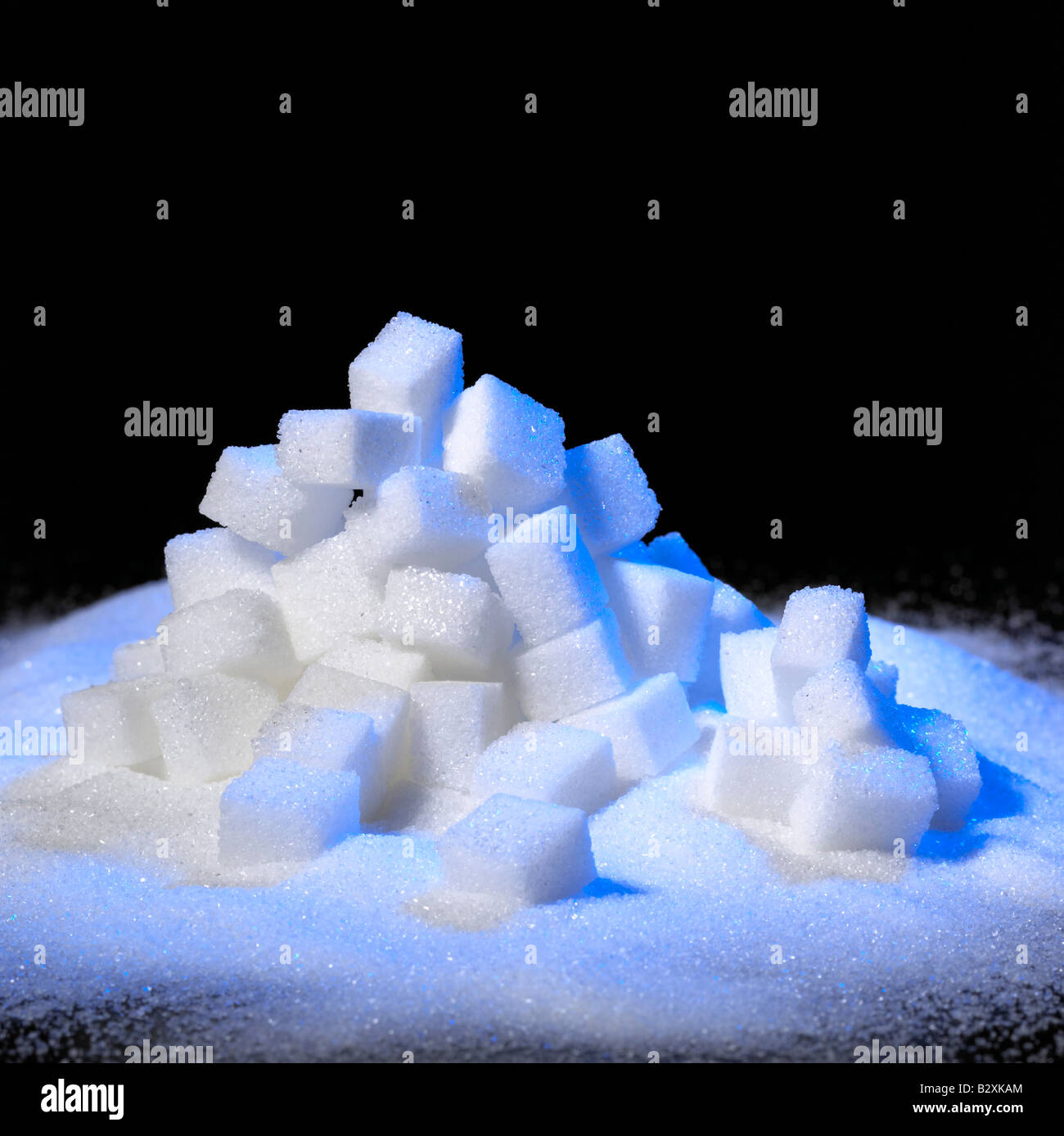 a pile of sugar cubes, blue illuminated, Germany Stock Photo