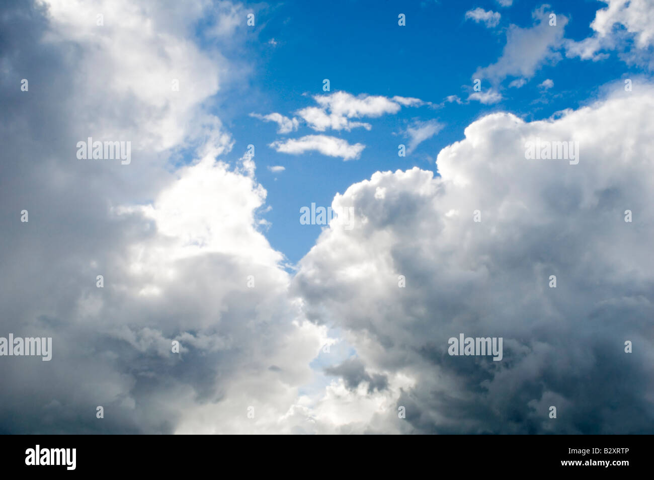 fleecy clouds grey clouds and blue sky Stock Photo