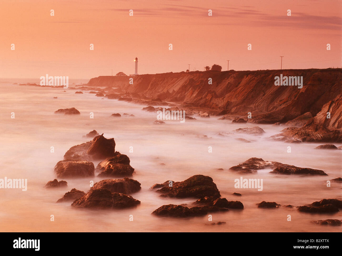 Point Arena Lighthouse on Pacific Coast in Mendocino County in Northern California at sunset Stock Photo