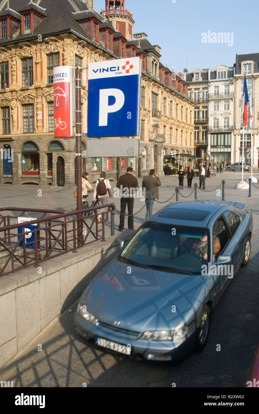 Car driving down a ramp into an underground car park in the french town of Lille, France Stock Photo