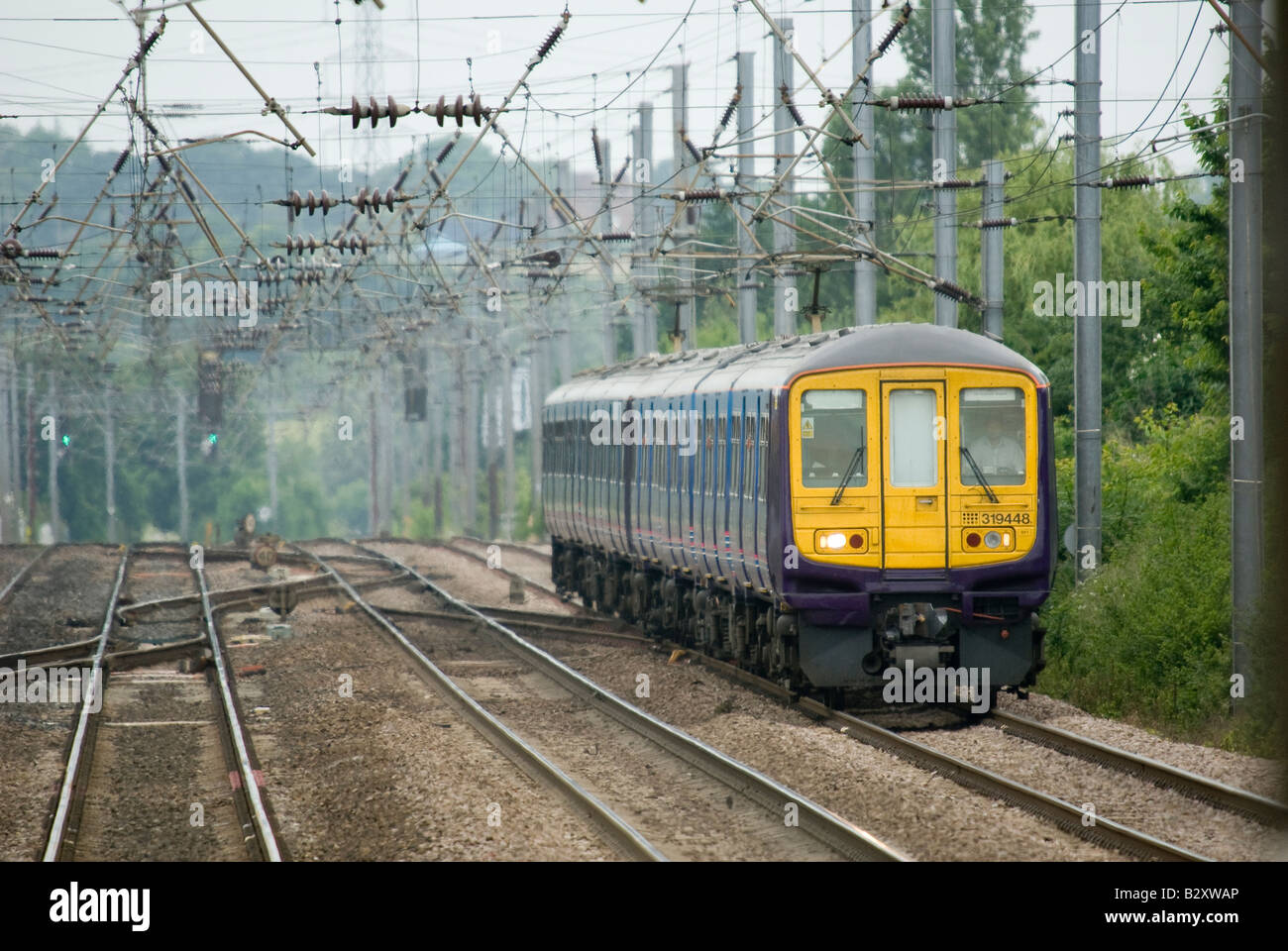 class 319 train in first capital connect livery travelling beneath ...