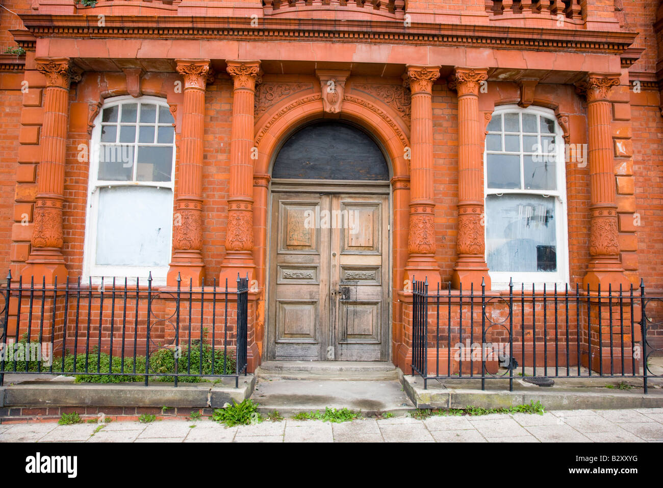 Elaborate red brick facade door and entrance to building Stock Photo