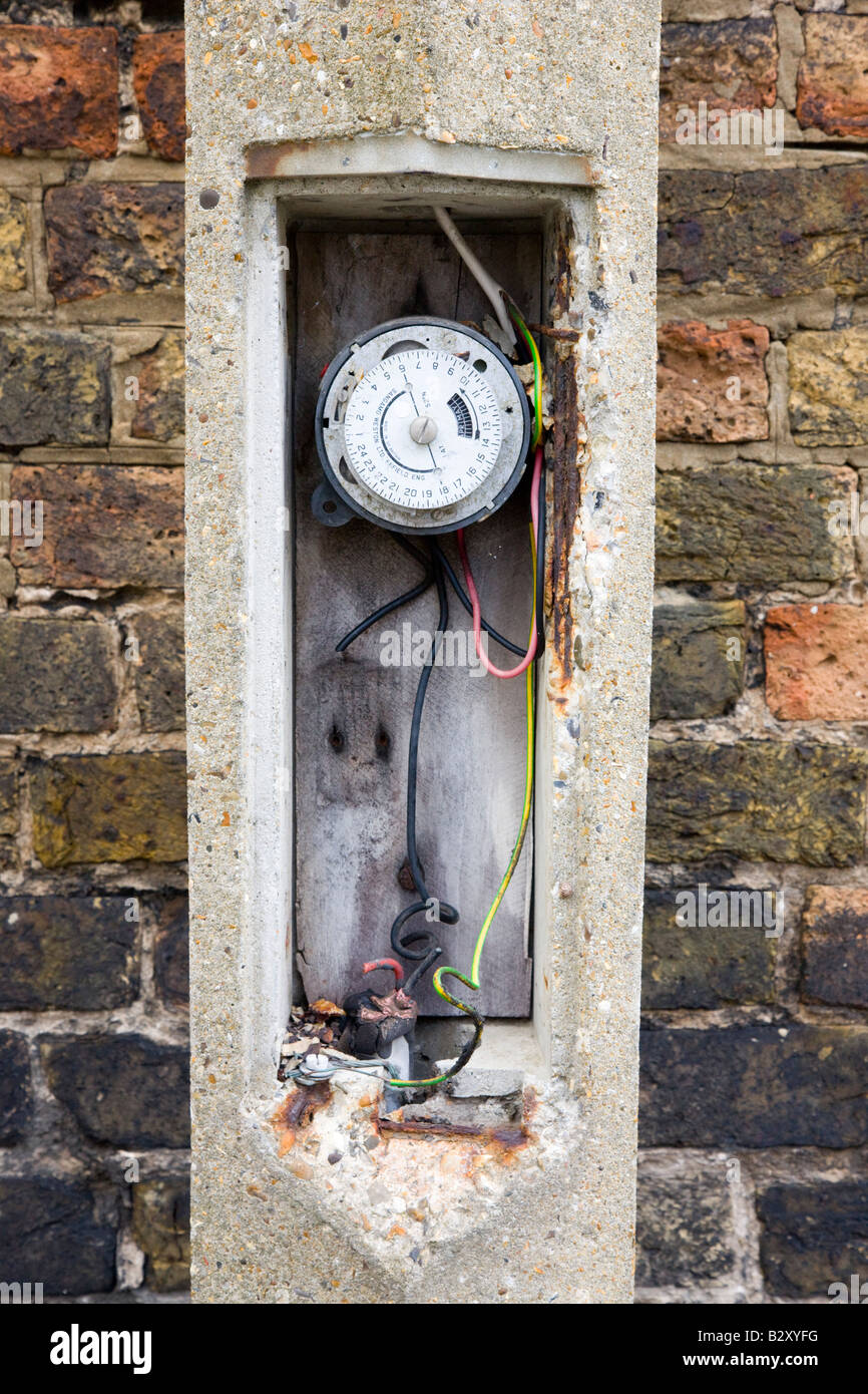 Timer inside concrete lamp post Stock Photo - Alamy