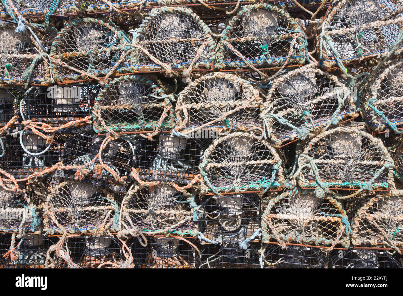 Lobster pots piled up on the beach Stock Photo