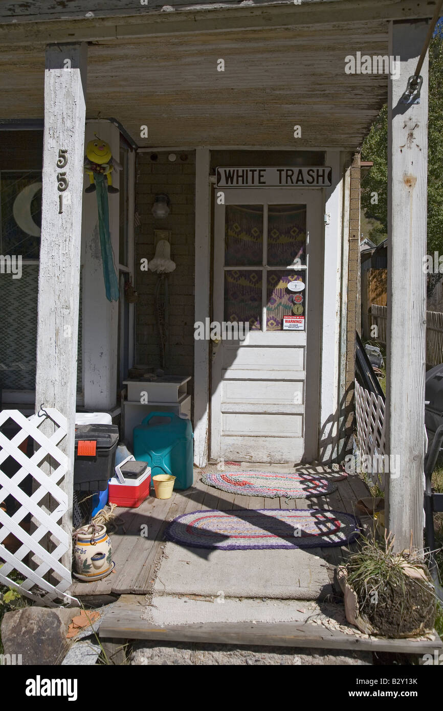 White Trash sign in doorway of junky house in Telluride, Colorado Stock Photo