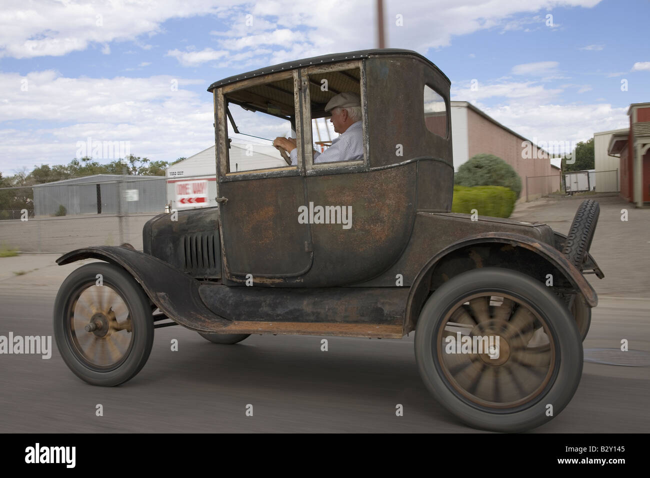 Model T Ford Hardtop car driving through Delta, Colorado Stock Photo