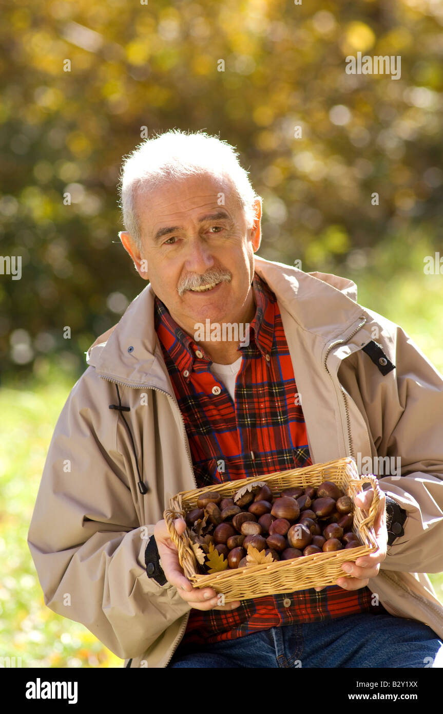 elderly man with chestnuts Stock Photo Alamy