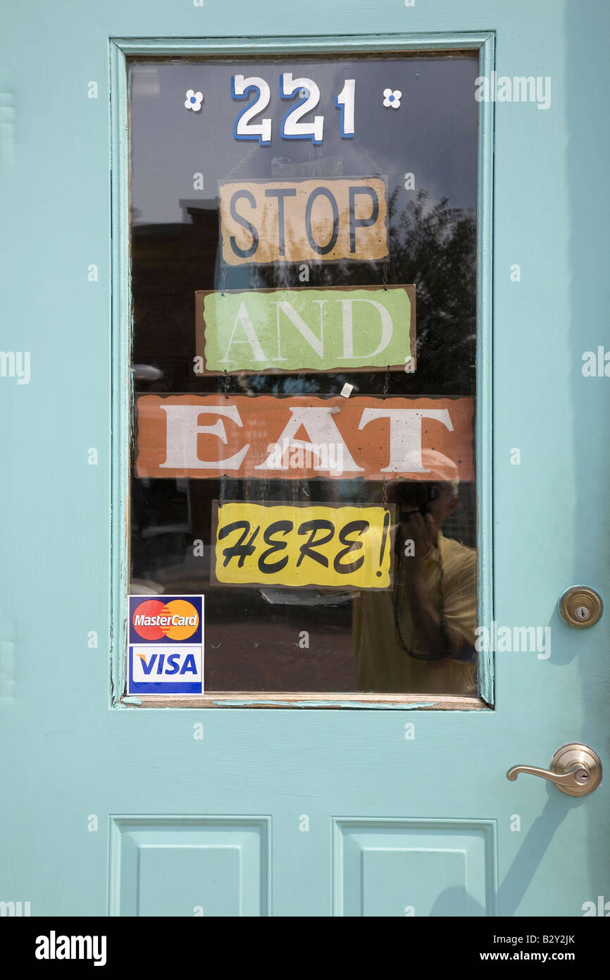 Sign on the door of "Aunt B" restaurant that reads "Stop and Eat Here