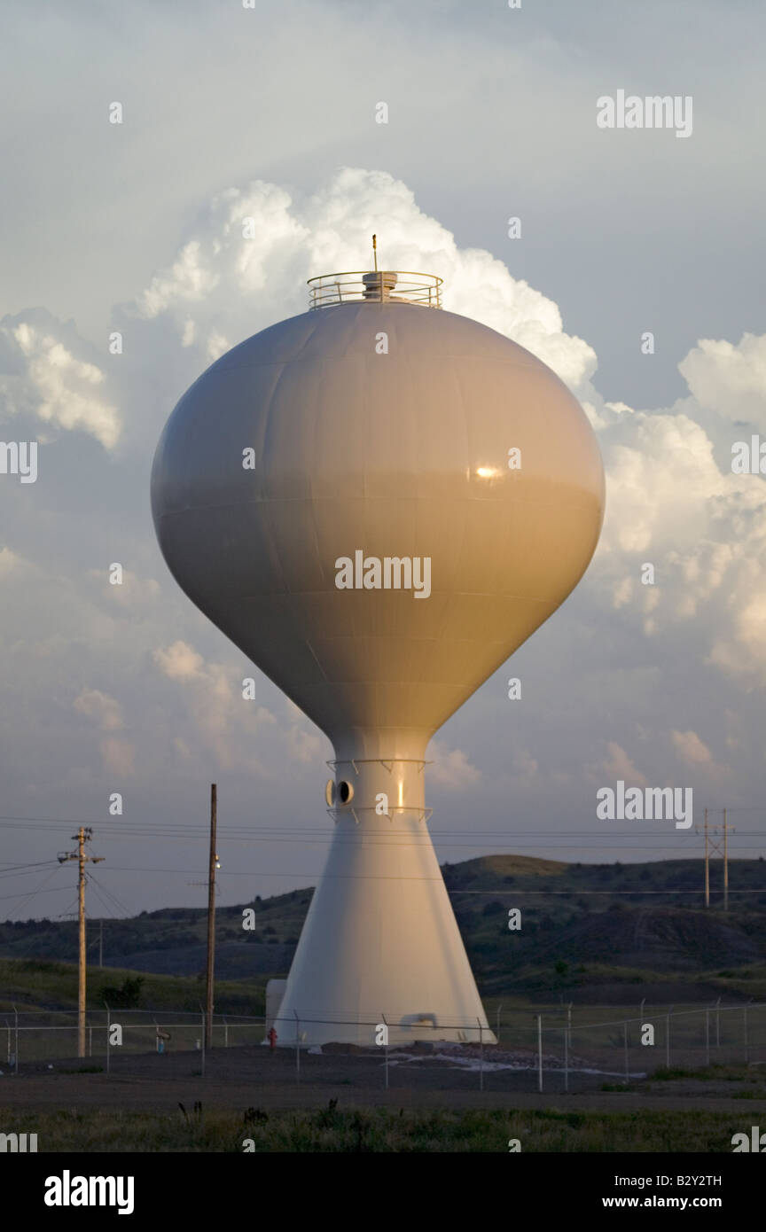 Water tower at sunset with clouds behind it in Lower Brule, Sioux