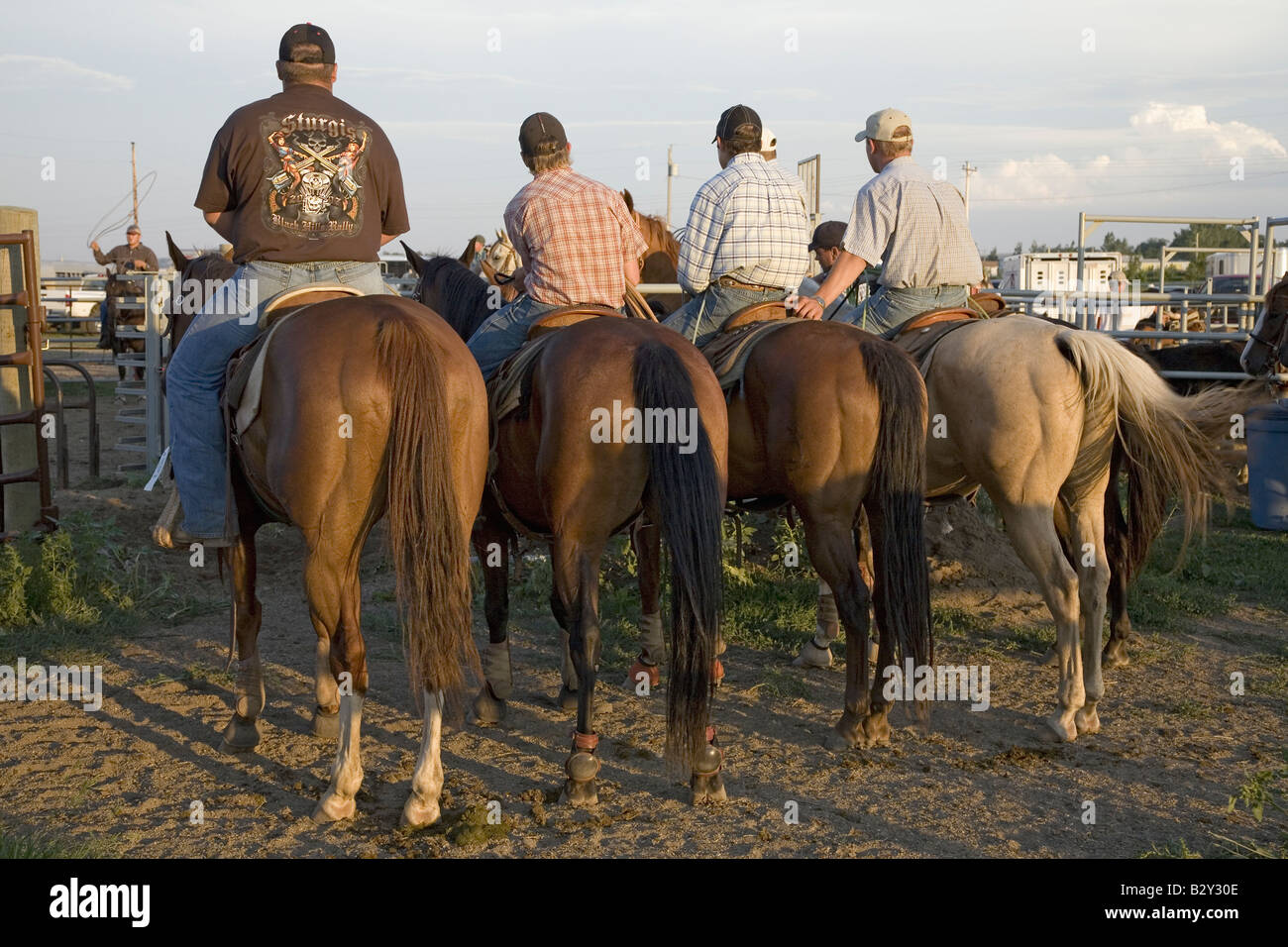Four cowboys at PRCA Rodeo at Lower Brule, Lyman County, Lower Brule Sioux Tribal Reservation, SD Stock Photo