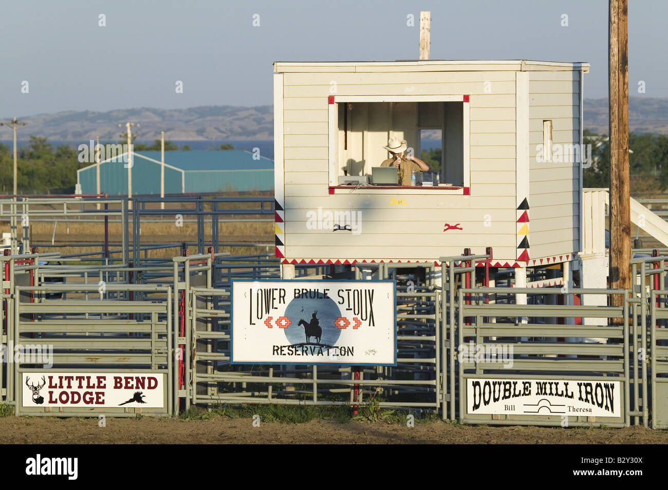 Announcer with cowboy hat at PRCA Rodeo at Lower Brule, Lyman County