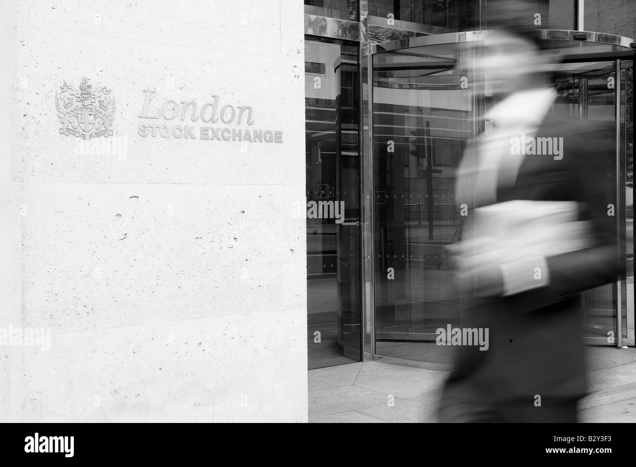 Business man walks past the London stock exchange Stock Photo