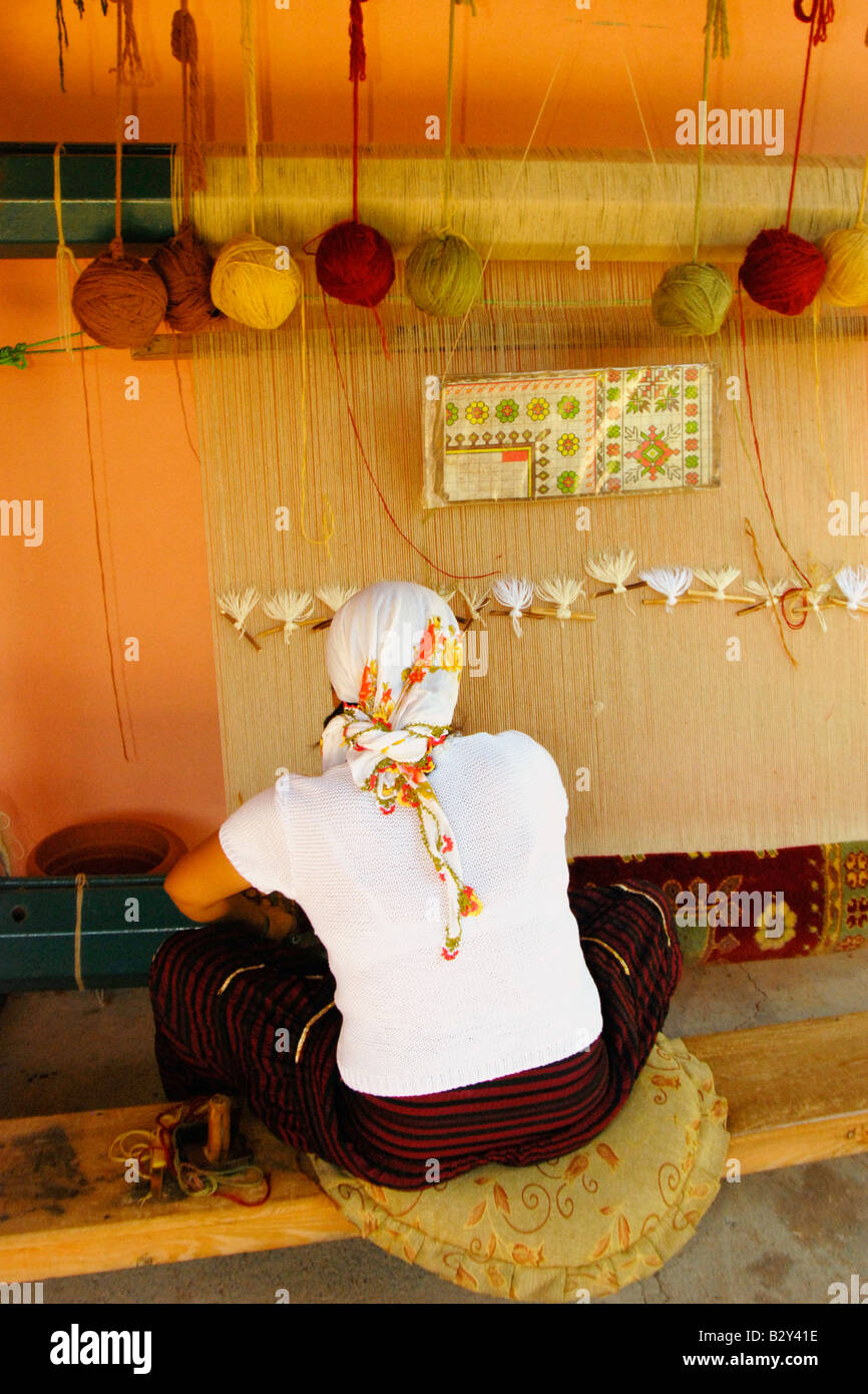 Turkish Woman Making Rug Turkish woman weaving rug at loom, Datca Peninsula, Turkey Stock Photo ...