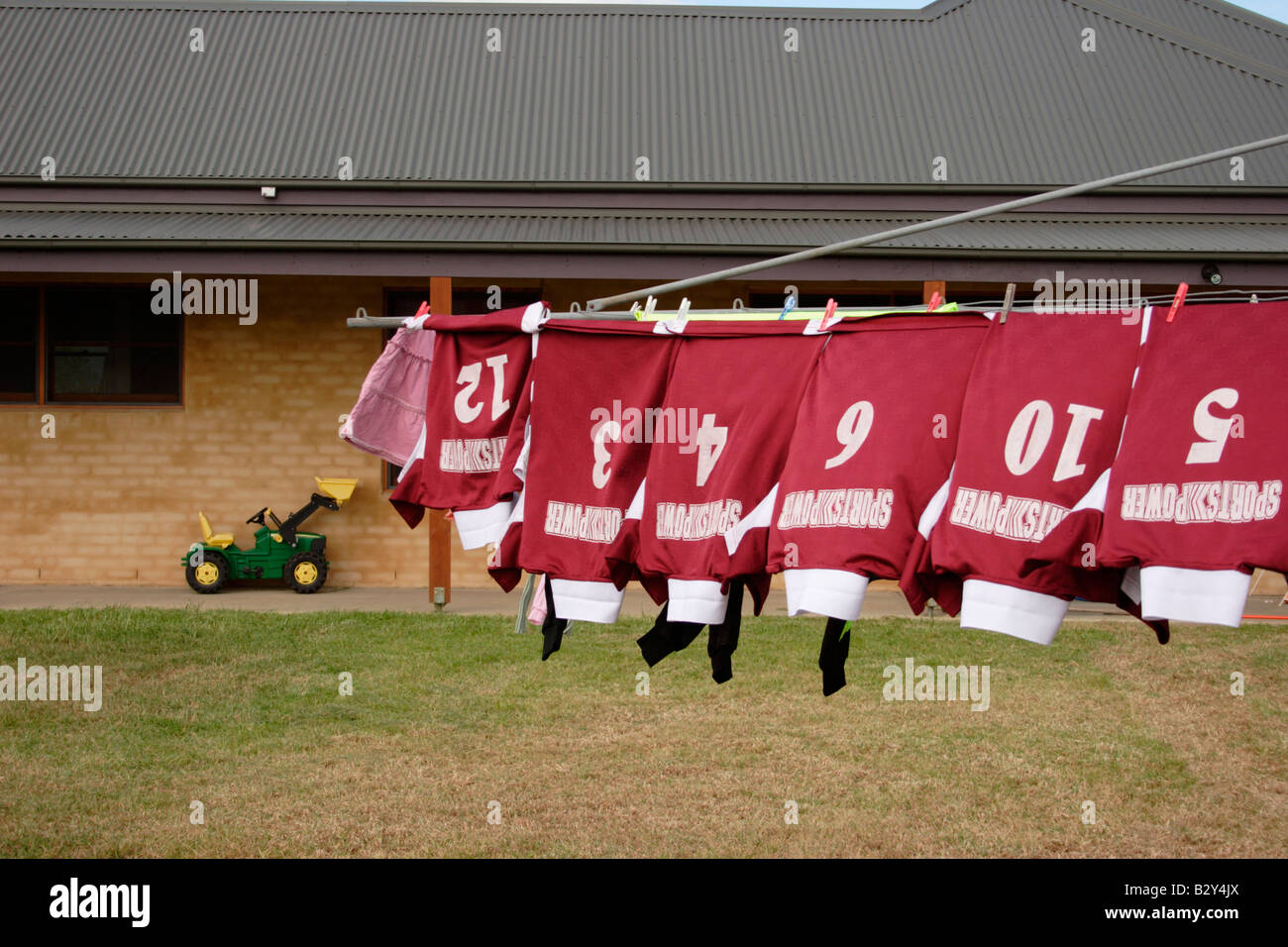 Football Shirts Drying on Washing Line New South Wales Australia Stock Photo