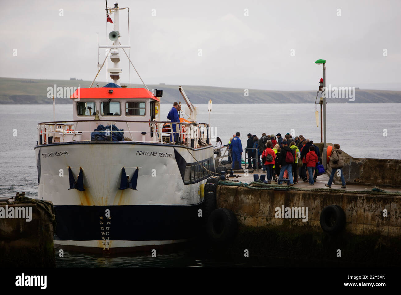 The John O'Groats ferry the Pentland Venture boards passengers before leaving John O'Groats harbour for the Orkneys in Scotland Stock Photo