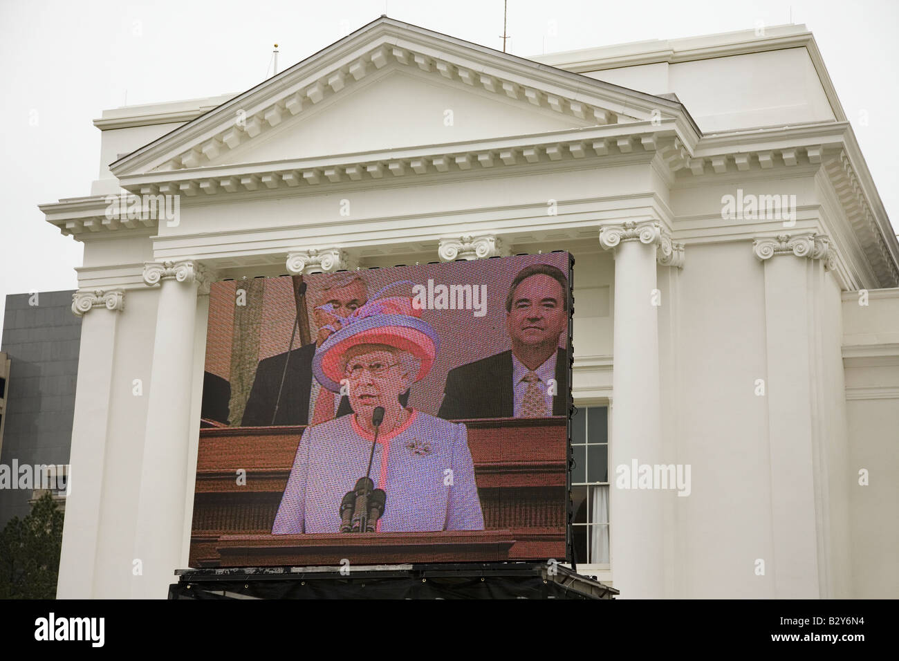 Queen Elizabeth II speaking on a large television monitor to the VA State Assembly, at the VA State Capitol in Richmond VA Stock Photo
