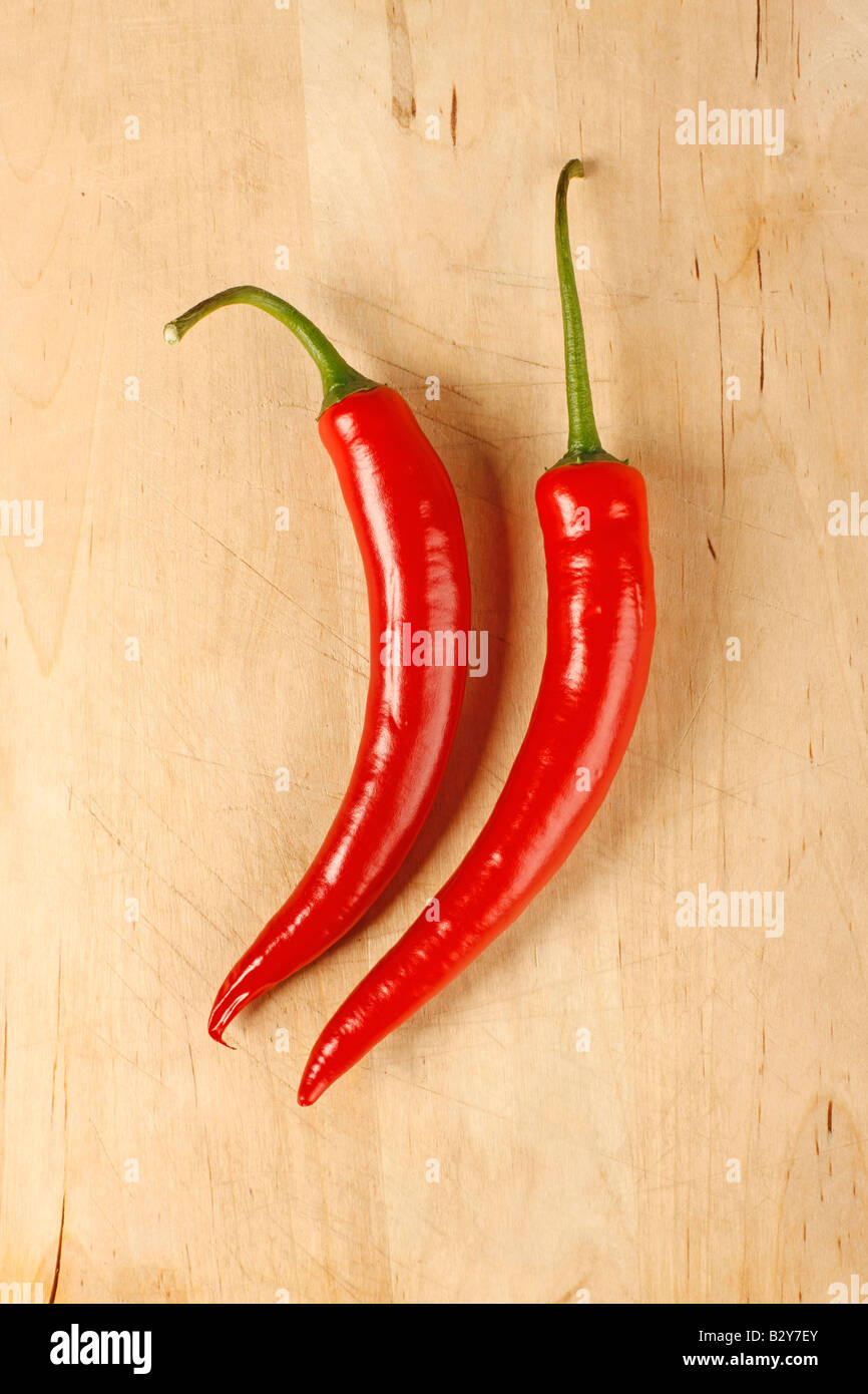 Red hot chilli peppers on a cutting board Stock Photo - Alamy