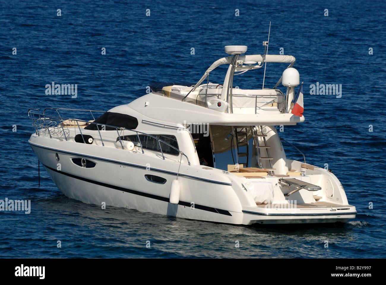 Small luxury Motor Yacht in the Mediterranean Sea Stock Photo