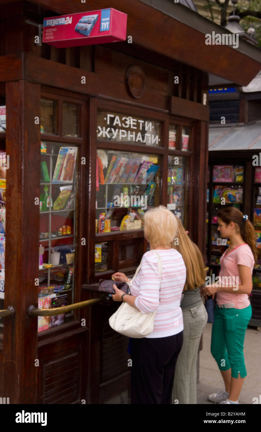 Women buying cigarettes at market in old town center city of Lviv