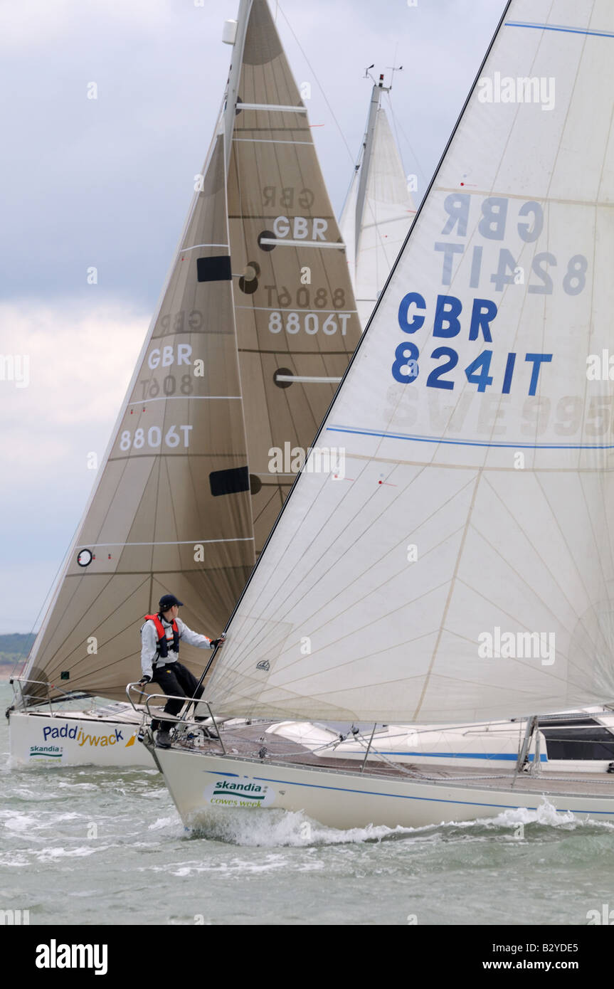 race start upwind bow of boats sailing Cowes Week Isle of Wight Stock Photo