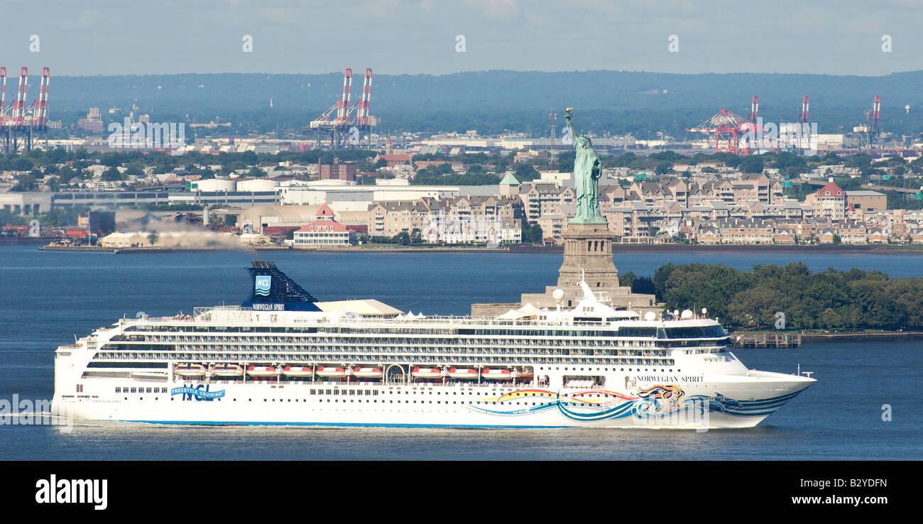 Cruise ship passing the Statue of Liberty entering New York harbour