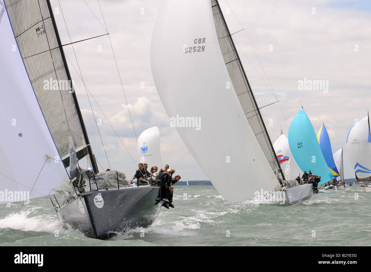 Bow of racing yacht TP52 design cutting through the waves sailing Cowes Week Isle of Wight Stock Photo
