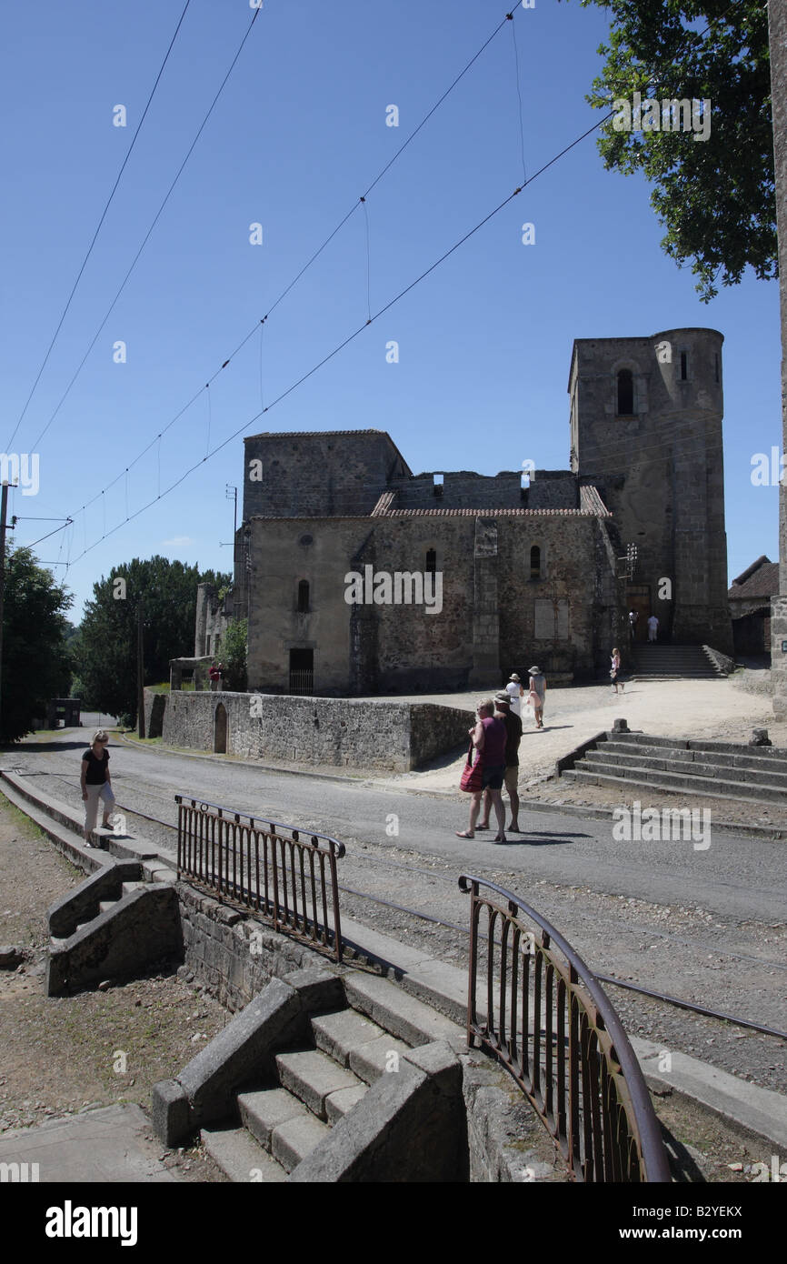 Visitors View the Remains of the Church in the Village of Oradour sur Glane in the Haute Vienne Department 87 of France Stock Photo