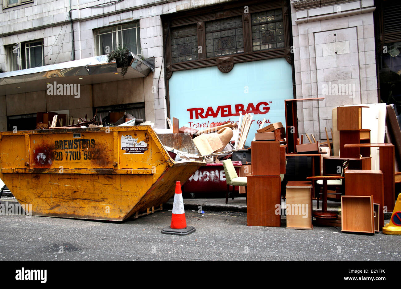 Old Furniture Piled Up In Street Outside Hotel Being Refurbished