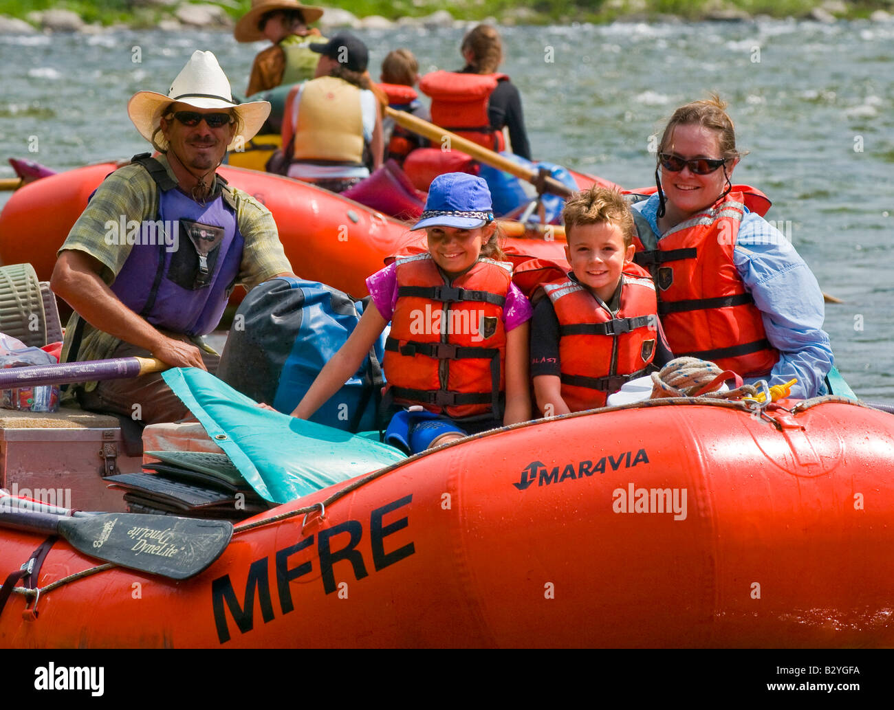 Idaho, Middle Fork of the Salmon River. Happy rafters and guide raft