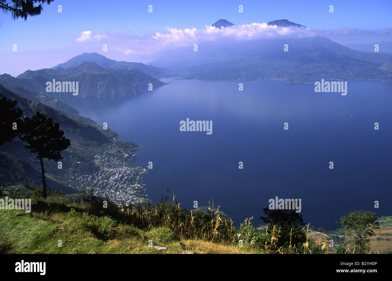 Lake Atitlan in the early morning with San Antonio Palopo on the left and Toliman Volcano and San Pedro Volcanoes Stock Photo