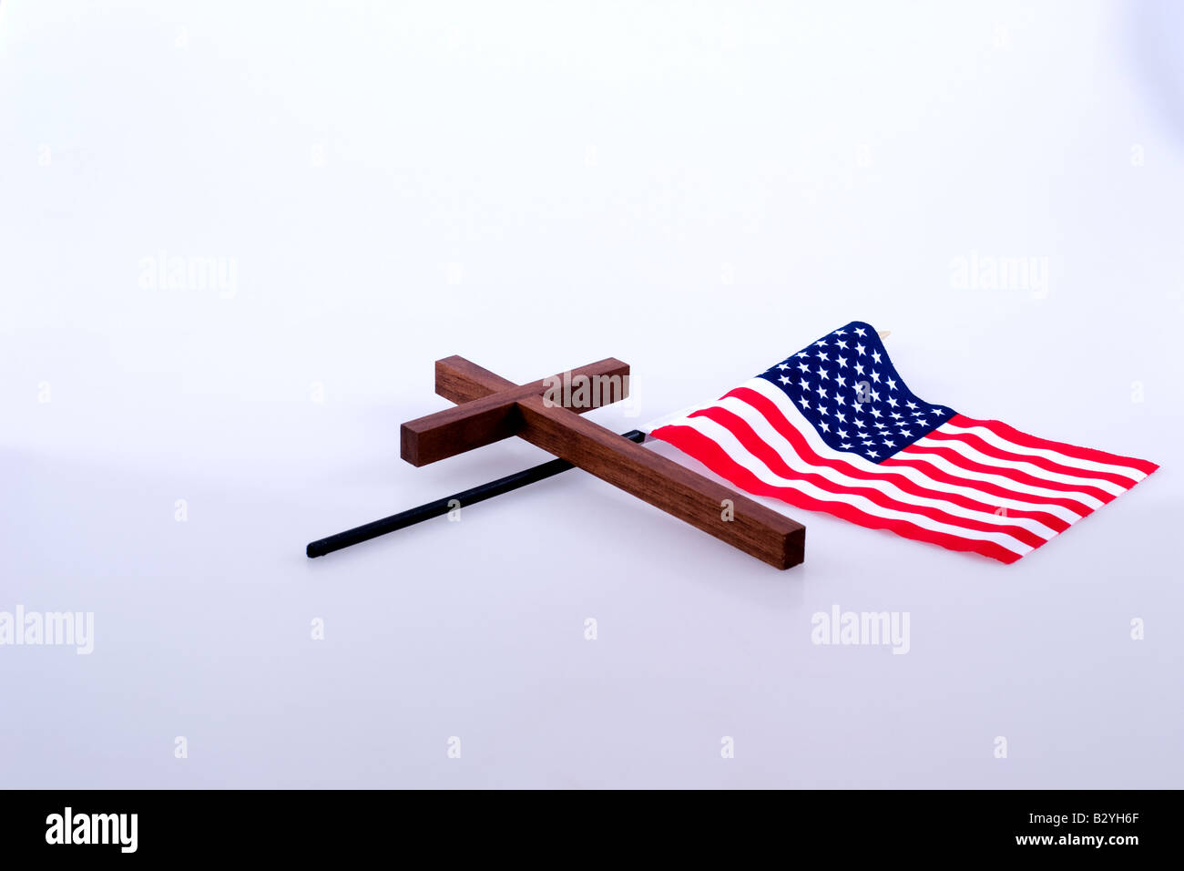 Christian cross and a small American flag Stock Photo