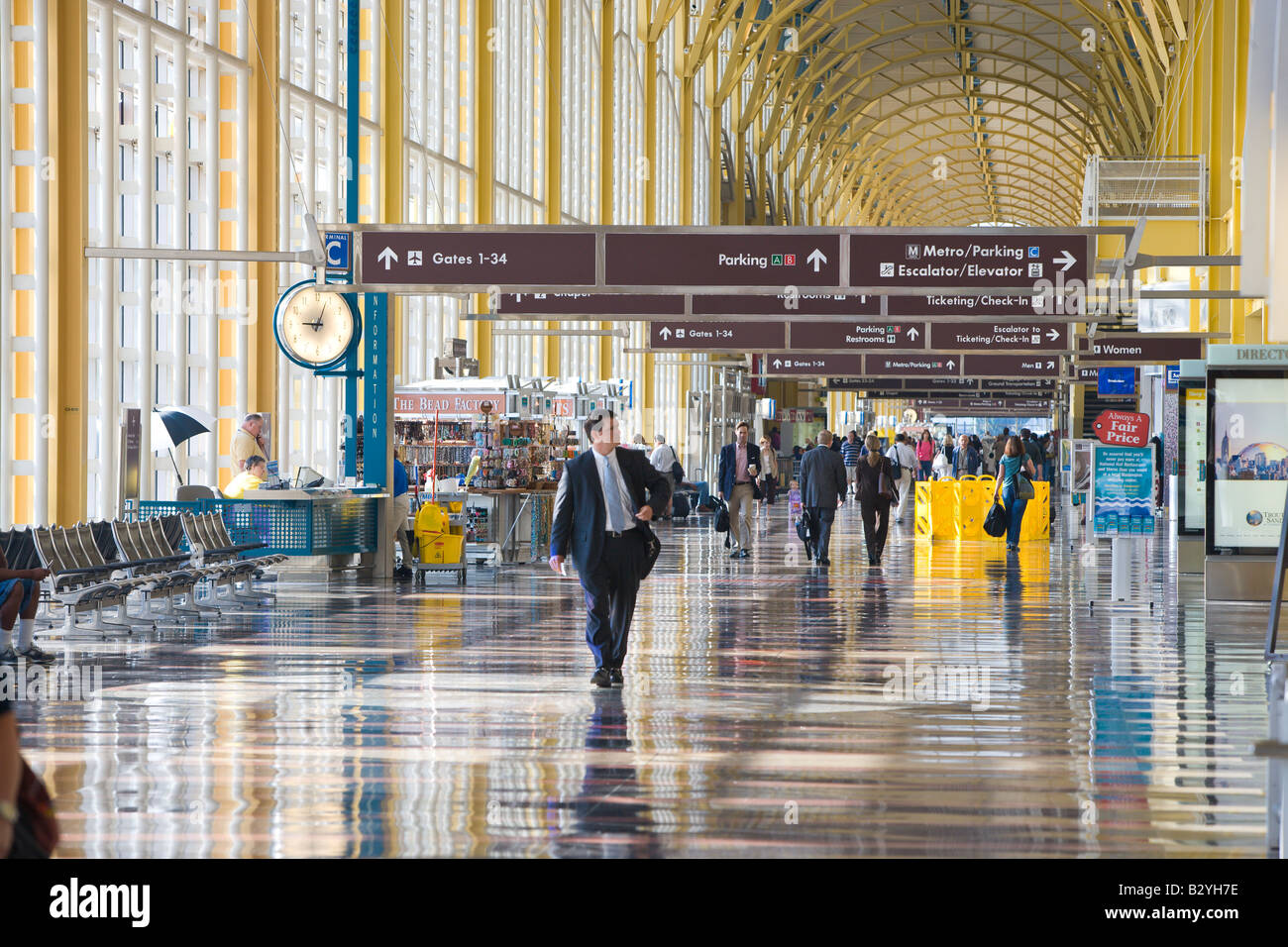 Passengers walk through the airport terminal at Ronald Reagan