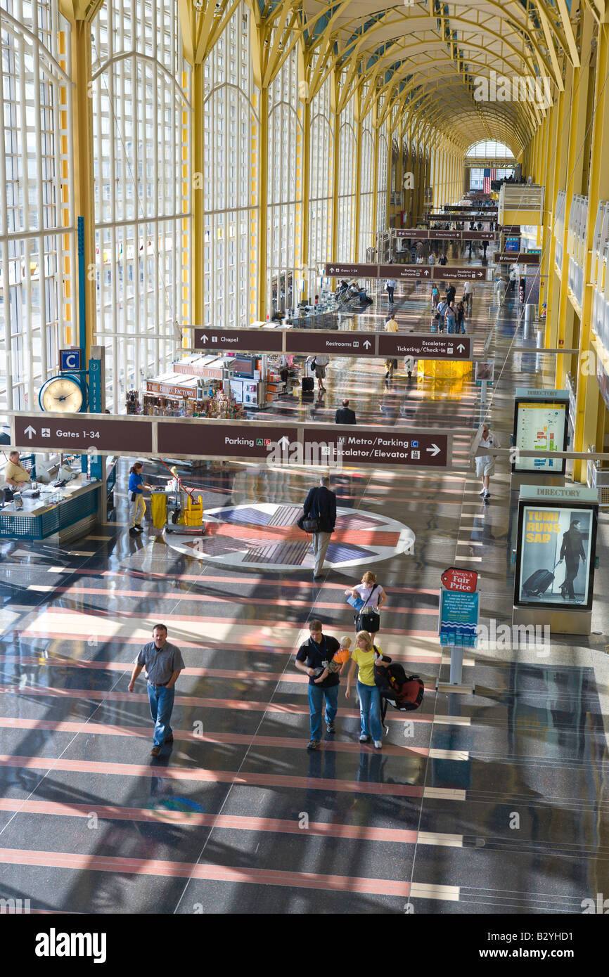 Passengers walk through the airport terminal at Ronald Reagan