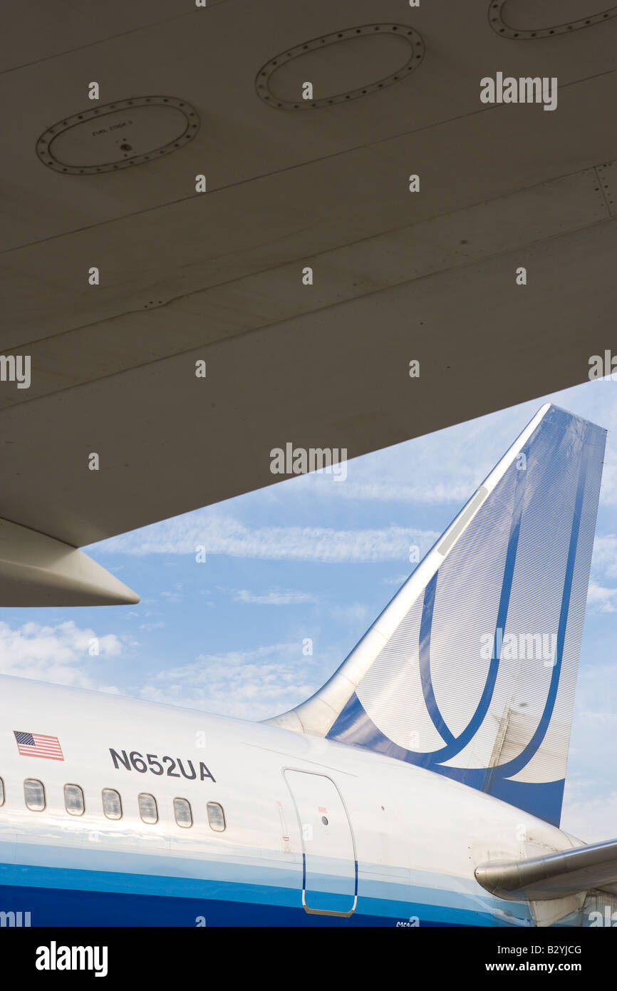 United Airlines airplane wing and sky with clouds Stock Photo