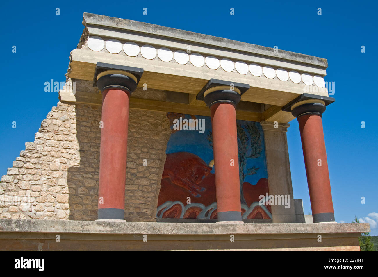 Knossos, Crete, Greece. Minoan Archaeological Site. Stucco Relief of Charging Bull (reproduction; original in Heraklion Museum) Stock Photo