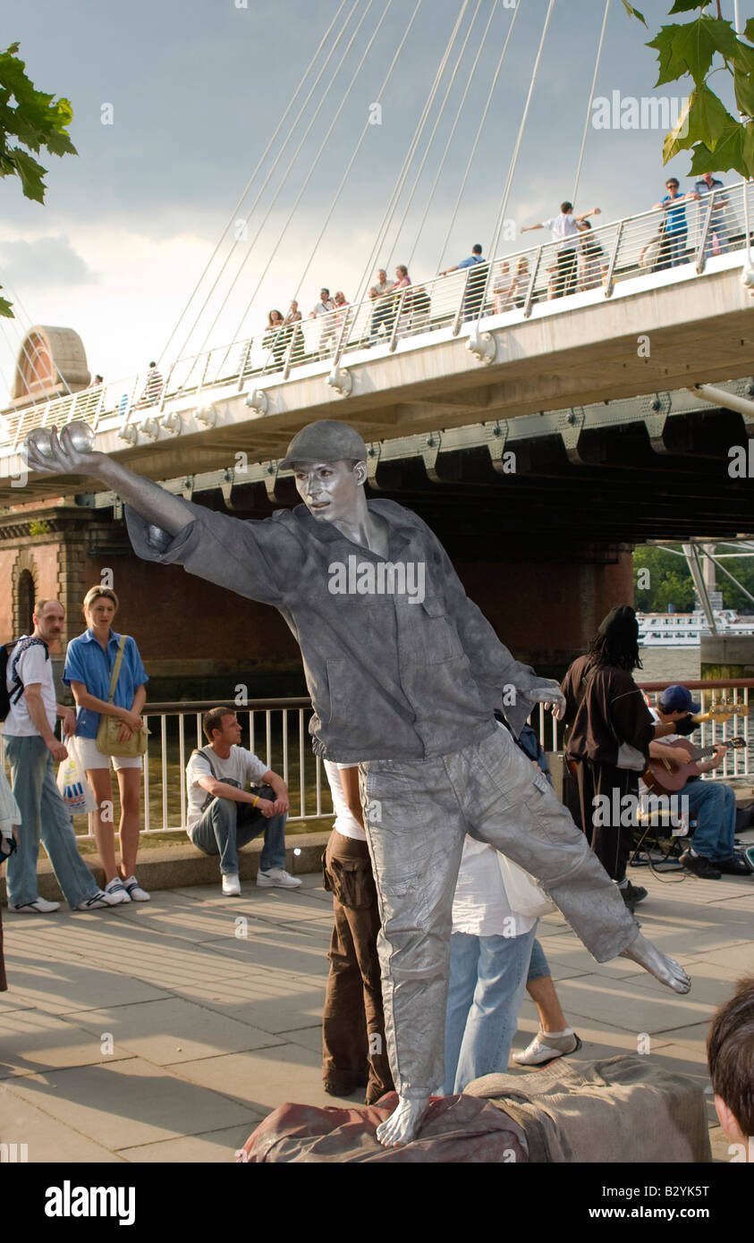 Silver street performer on the South Bank, London, UK Stock Photo