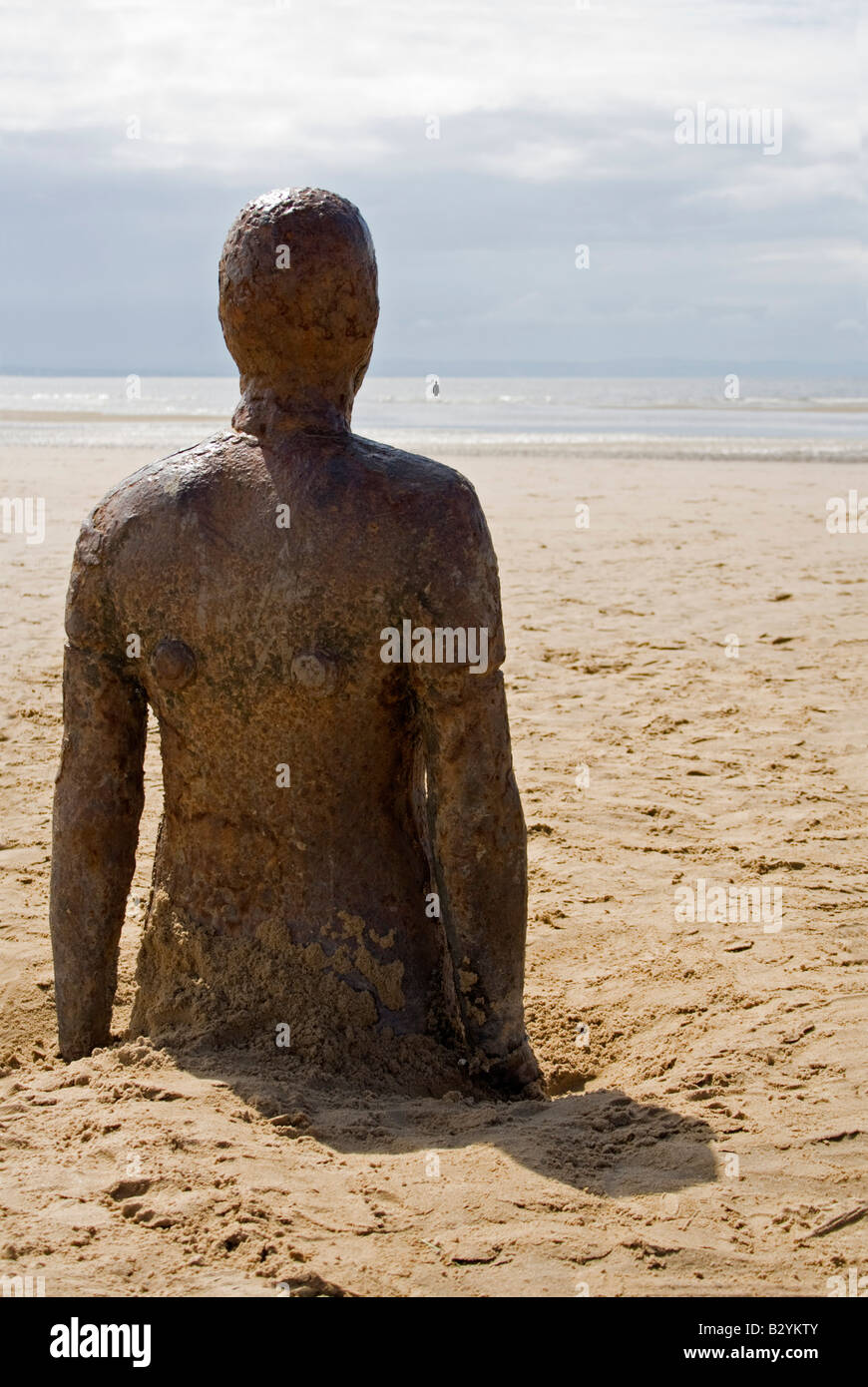 one of antony gormley's another place figures Stock Photo