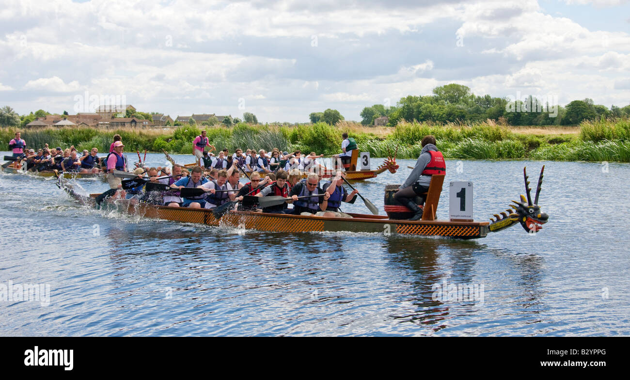 Three Dragon boats racing on the River Ouse during a Riverside Gala Stock Photo