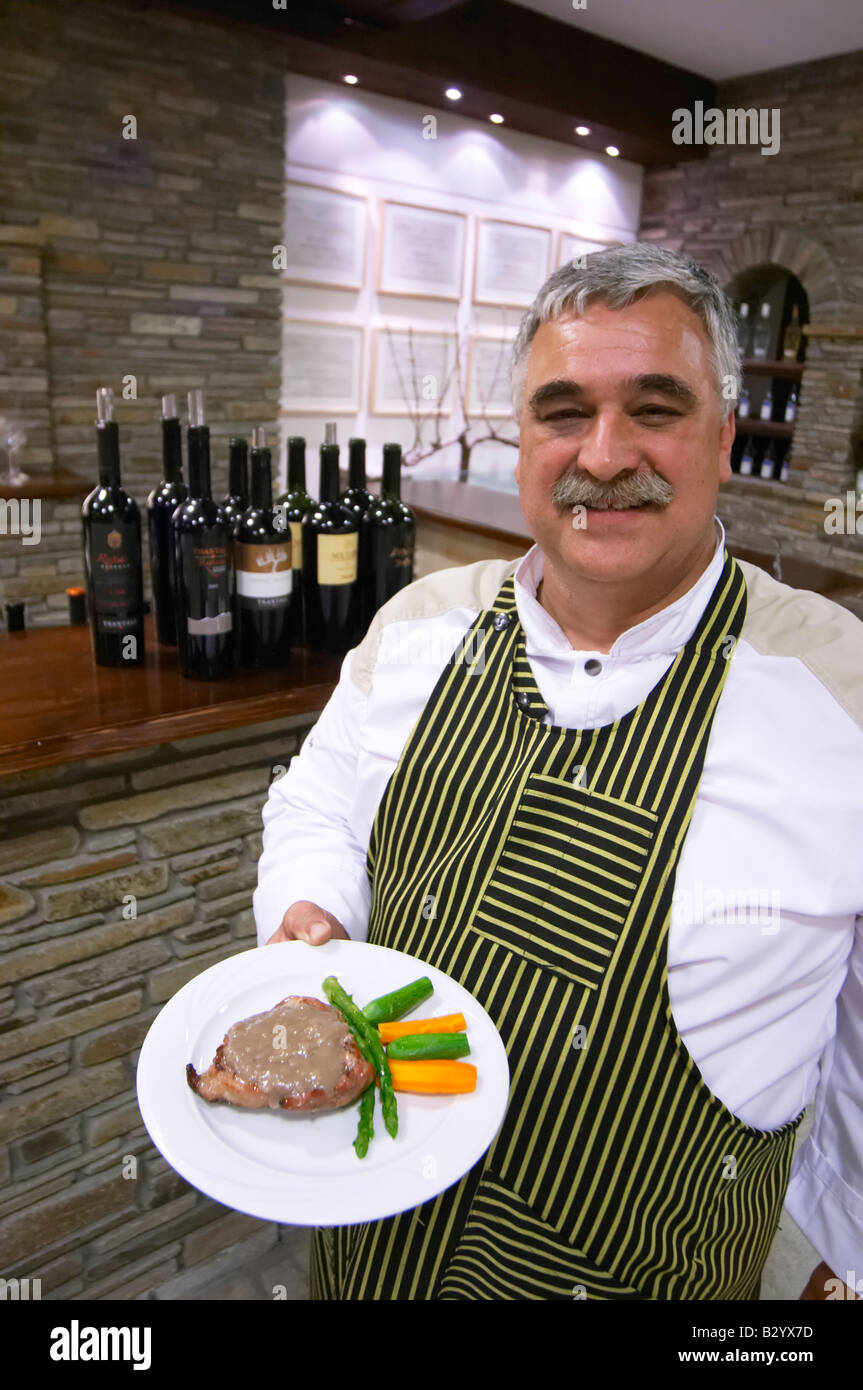 Chef showing typical Greek dish. Tsantali Vineyards & Winery, Halkidiki, Macedonia, Greece. Stock Photo