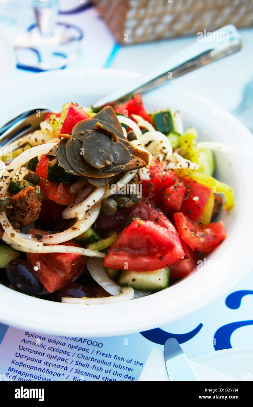 Dinner at a waterfront restaurant. Greek salad. Seafood restaurant at Macedonia Palace Hotel. Thessaloniki, Macedonia, Greece Stock Photo