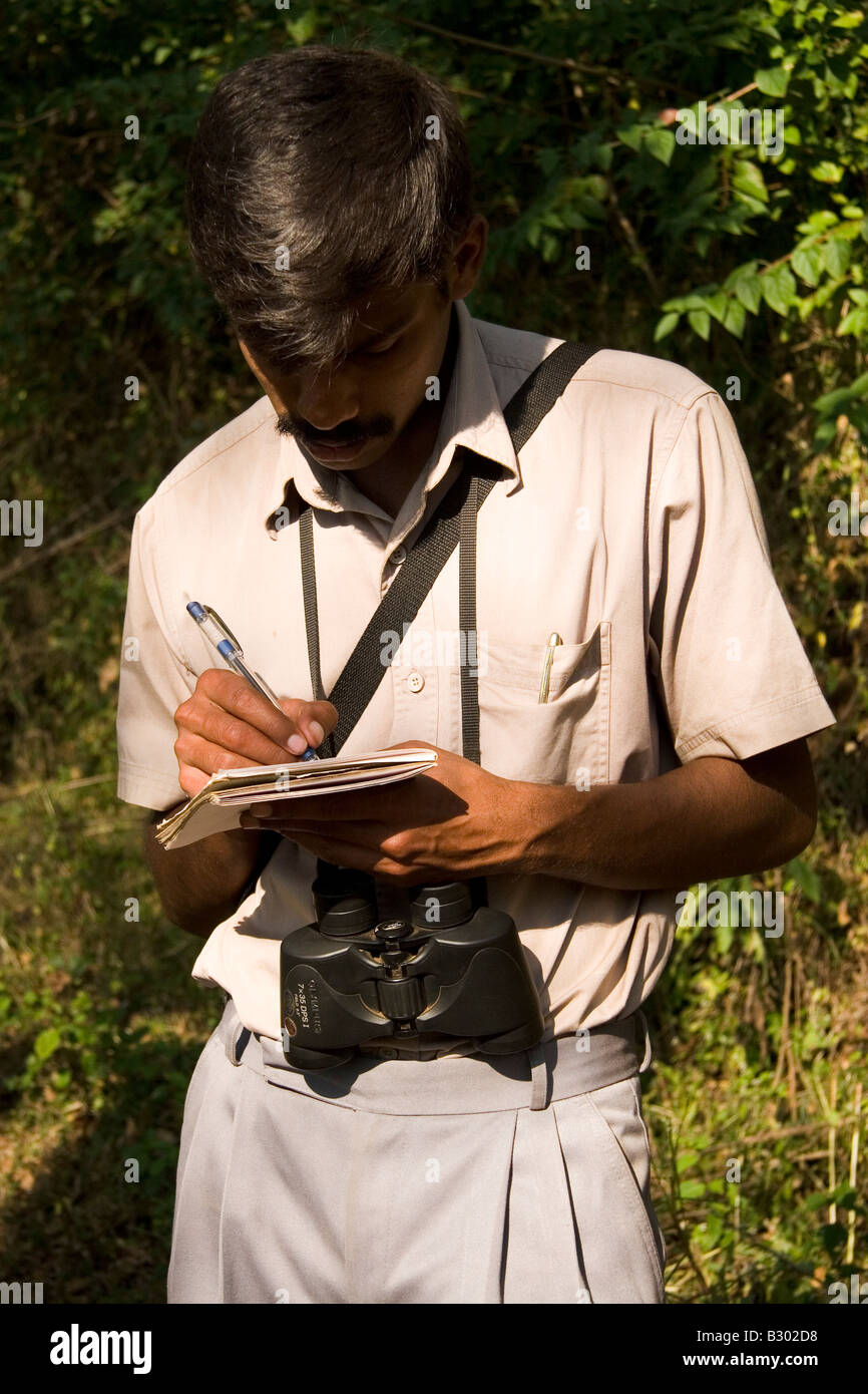A participant and naturalist makes notes during the Indian National Tiger Census. Stock Photo