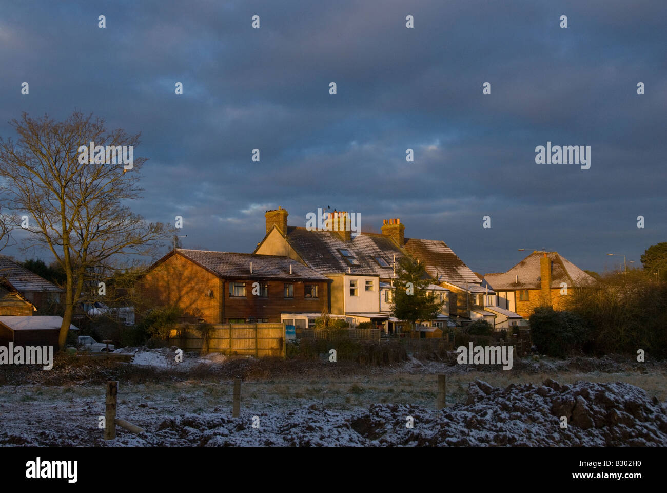 Snow on fields beside houses, dawn, Biggin Hill, Kent England UK Stock