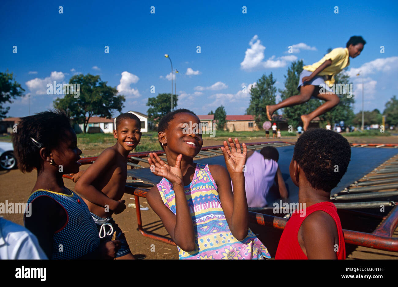 Children playing on a trampoline in Johannesburg, South Africa Stock