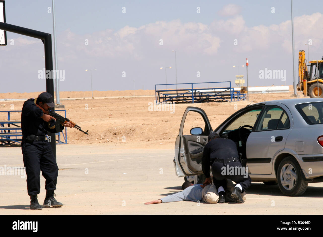 Iraqi police training on arresting suspect from car vehicle check point Stock Photo