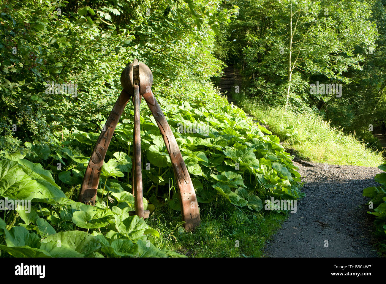 sculpture on a woodland footpath Stock Photo