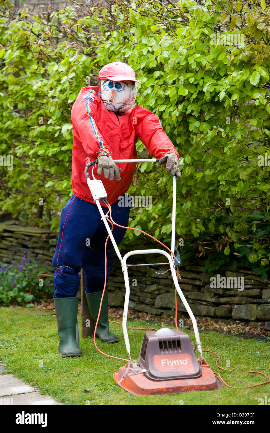 scarecrow with hover mower in village festival Stock Photo
