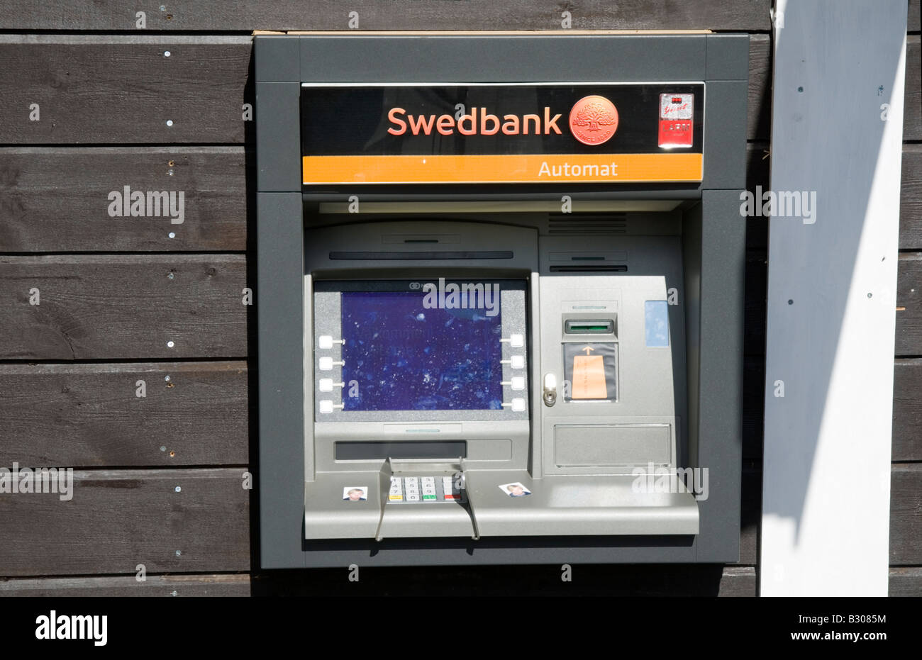 cash dispenser hole in the wall machine bank banking money pin keypad Stock Photo