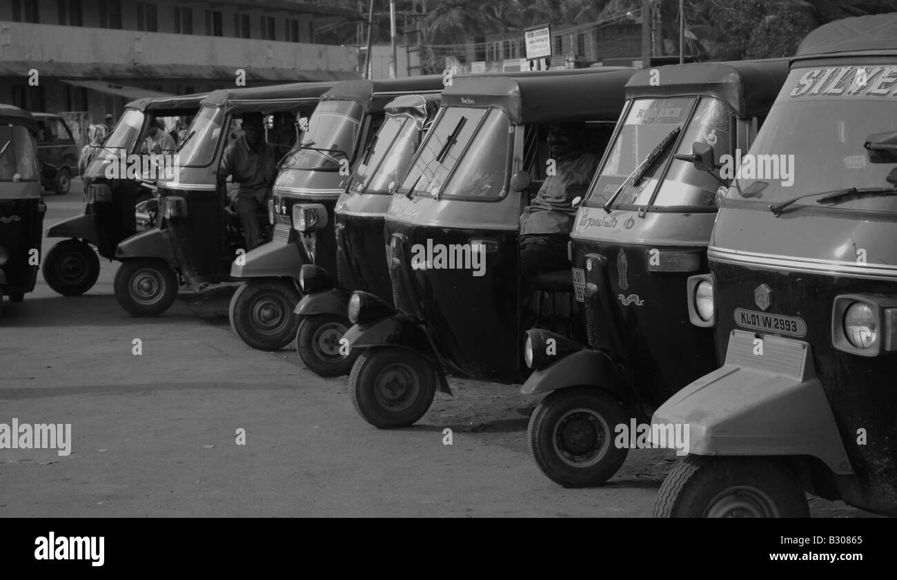 Auto rickshaws waiting for passengers at Vizhinjam Harbour, Trivandrum, Kerala, India Stock Photo