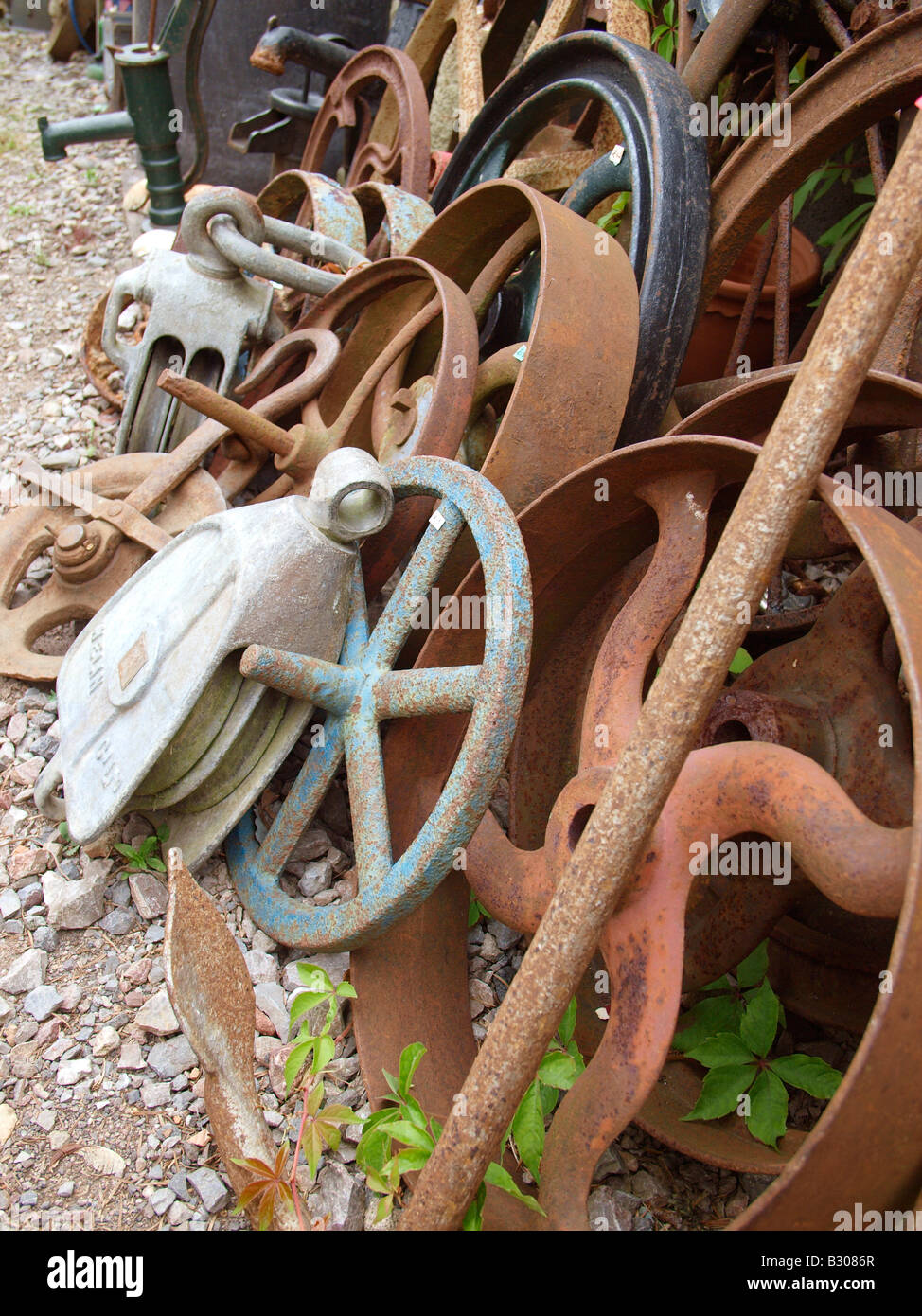A collection of rusty antique wheels in reclaim yard Stock Photo - Alamy