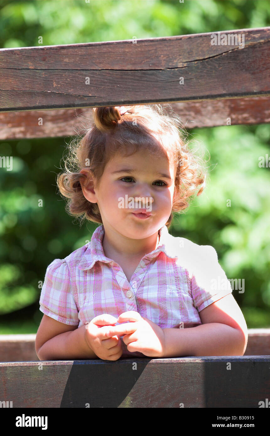 Portrait of cute little girl with curly hair close up Stock Photo Alamy
